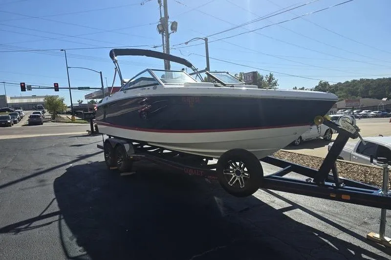 Slide: The Image of 2022 Cobalt R4 boat on trailer in parking lot, sunny day. - 6