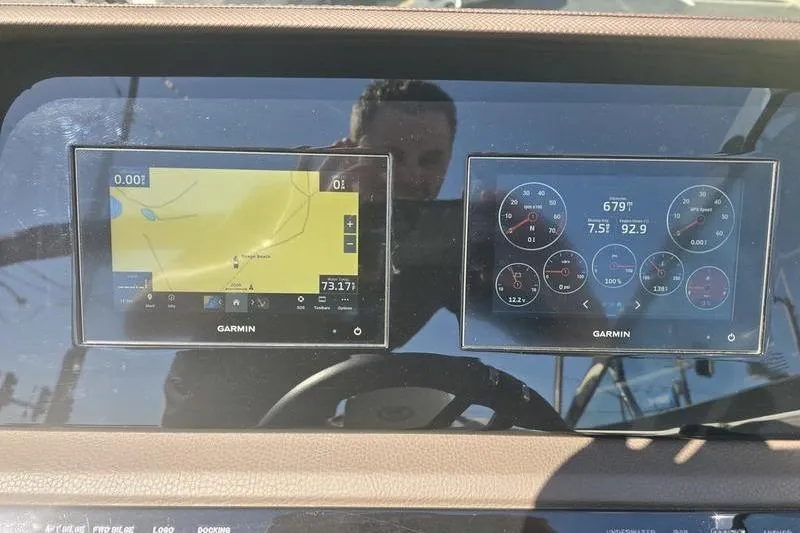 Slide: The Image of Dashboard of a 2022 Cobalt R4 boat with Garmin navigation displays. - 7