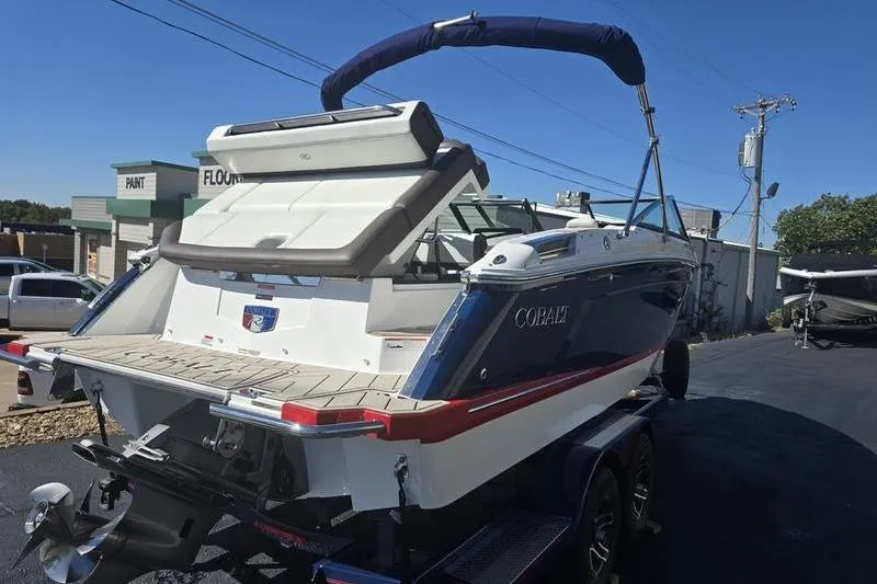 Slide: The Image of 2022 Cobalt R4 boat on trailer, rear view, sunny day, outdoor setting. - 8