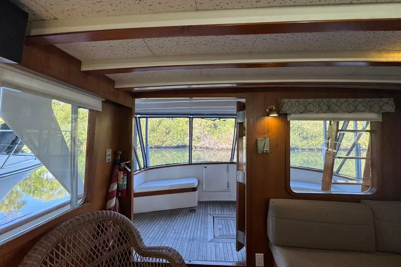 Slide: The Image of Interior of 1979 De Fever Pilot House with wooden accents and outdoor view. - 21