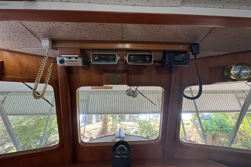 Slide: The Image of 1979 De Fever Pilot House interior with navigation equipment and windows. - 38