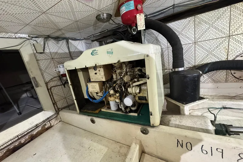 Slide: The Image of Engine room of 1979 De Fever Pilot House with Onan generator and ventilation system. - 55