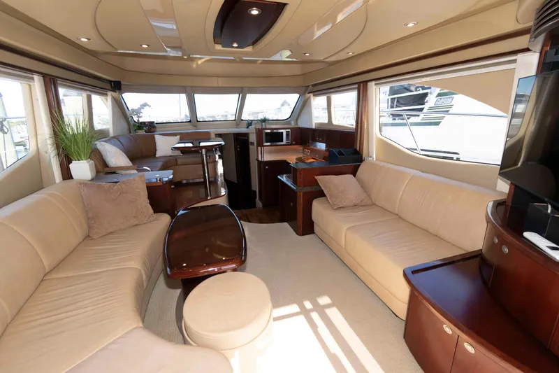 Slide: The Image of Luxurious interior of 2006 Sea Ray 52 Sedan Bridge yacht with plush seating and elegant decor. - 21
