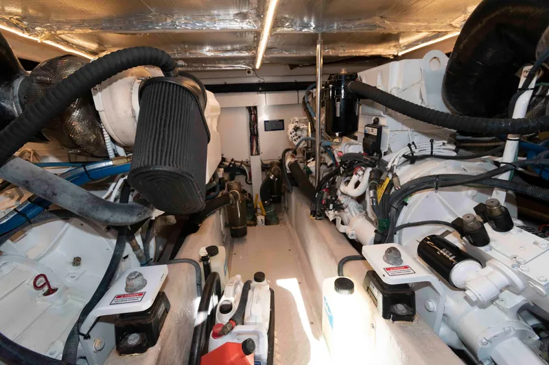 Slide: The Image of Engine room of 2006 Sea Ray 52 Sedan Bridge, showcasing mechanical components and systems. - 34