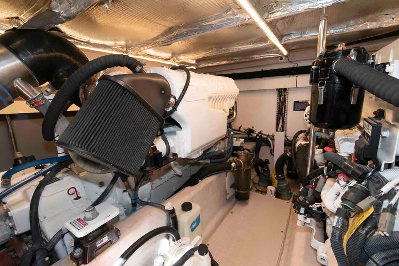 Slide: The Image of Engine room of 2006 Sea Ray 52 Sedan Bridge, showcasing mechanical components and systems. - 36