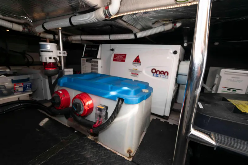 Slide: The Image of Engine room of 2006 Sea Ray 52 Sedan Bridge with Onan generator and electrical components. - 38