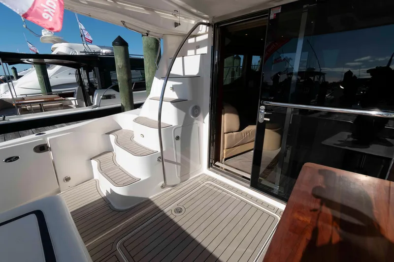 Slide: The Image of 2006 Sea Ray 52 Sedan Bridge yacht interior with stairs and sliding glass door. - 5