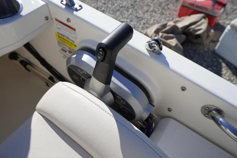 Slide: The Image of 2023 Boston Whaler 130 Super Sport throttle control and seat detail. - 32
