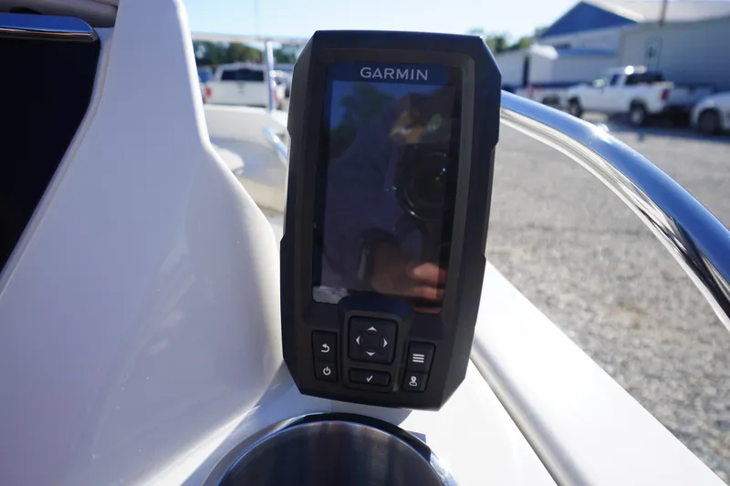 Slide: The Image of Garmin device on 2023 Boston Whaler 130 Super Sport boat dashboard. - 33
