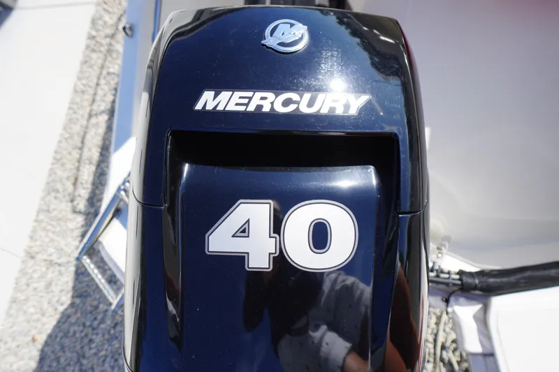 Slide: The Image of Mercury 40 horsepower engine on 2023 Boston Whaler 130 Super Sport boat. - 37