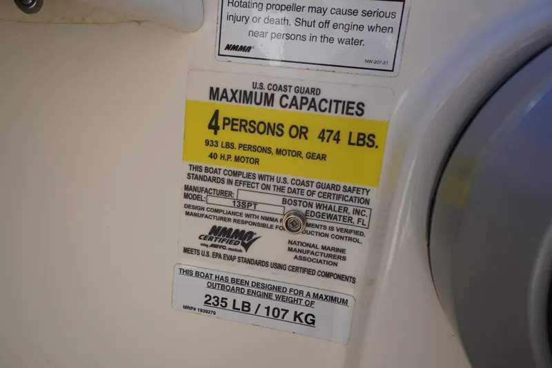 Slide: The Image of 2023 Boston Whaler 130 Super Sport capacity label, 4 persons or 474 lbs, 40 HP motor. - 38