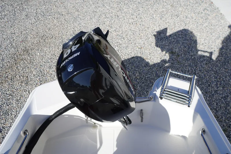 Slide: The Image of 2023 Boston Whaler 130 Super Sport with Mercury 40 HP engine and ladder. - 39