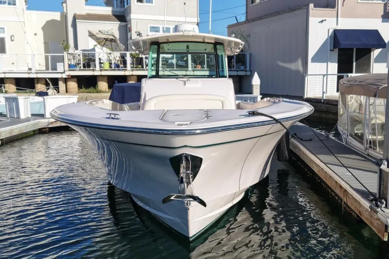 Slide: The Image of 2014 Grady-White Canyon 376 boat docked at marina, front view. - 2