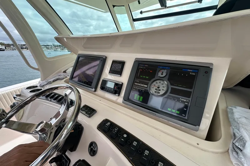 Slide: The Image of 2014 Grady-White Canyon 376 helm with advanced navigation and control displays. - 32