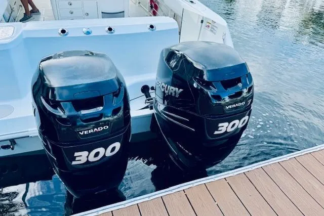 Slide: The Image of 2016 Boston Whaler 320 Outrage with twin Mercury Verado 300 engines docked. - 12