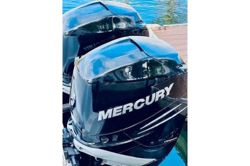 Slide: The Image of Twin Mercury outboard engines on a 2016 Boston Whaler 320 Outrage boat. - 13