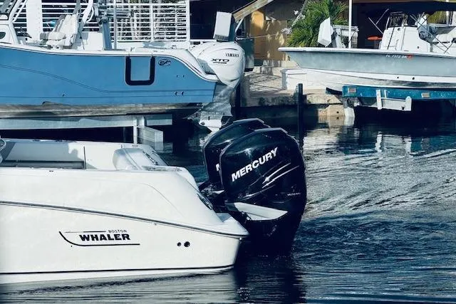 Slide: The Image of 2016 Boston Whaler 320 Outrage with Mercury engine docked in marina. - 19