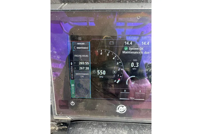 Slide: The Image of Dashboard of a 2016 Boston Whaler 320 Outrage showing engine hours and maintenance status. - 9