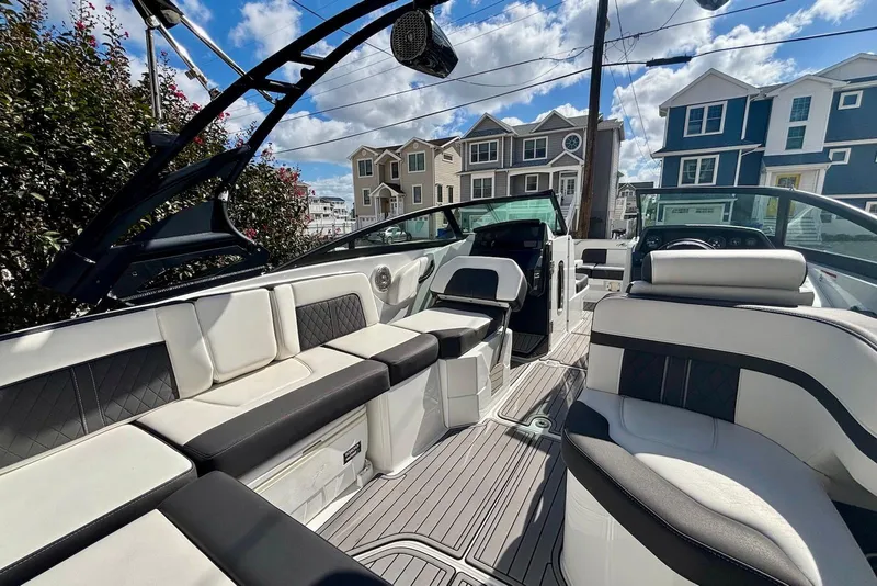 Slide: The Image of 2021 Monterey M-65 boat interior with luxurious seating and modern design. - 10