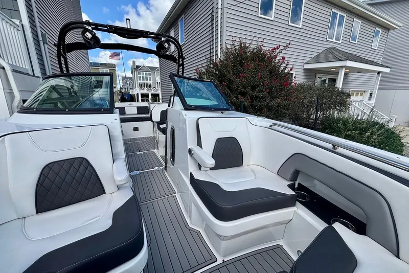 Slide: The Image of 2021 Monterey M-65 boat interior with sleek seating and modern design. - 11