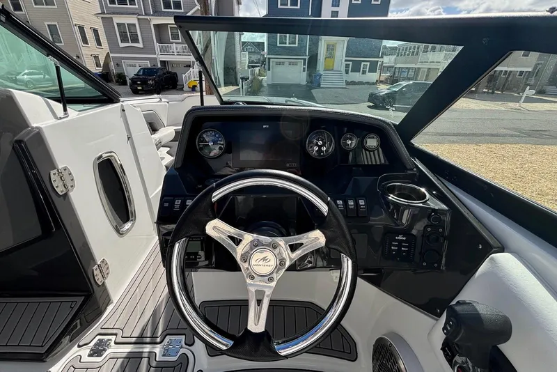 Slide: The Image of Steering wheel and dashboard of 2021 Monterey M-65 boat, parked in residential area. - 14
