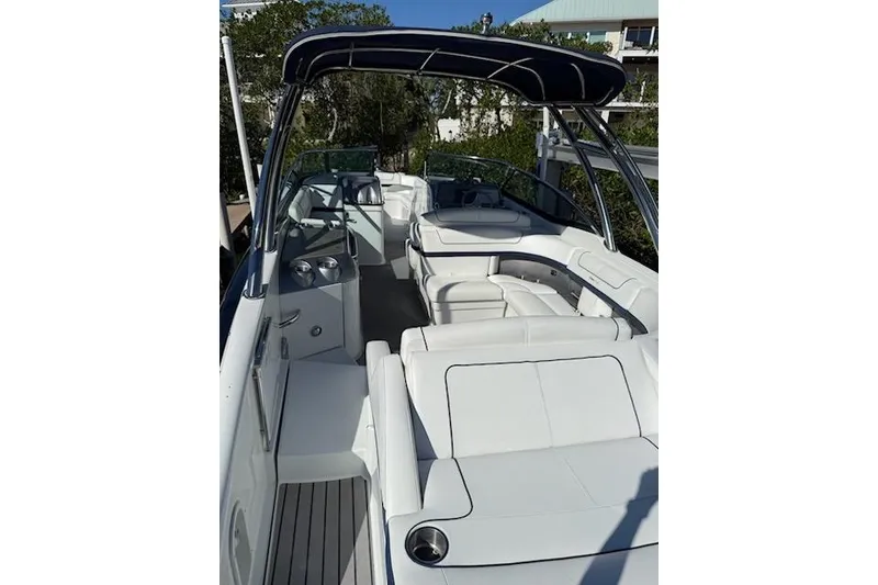 Slide: The Image of 2015 Formula 310 Bowrider with spacious white seating and sleek design. - 4