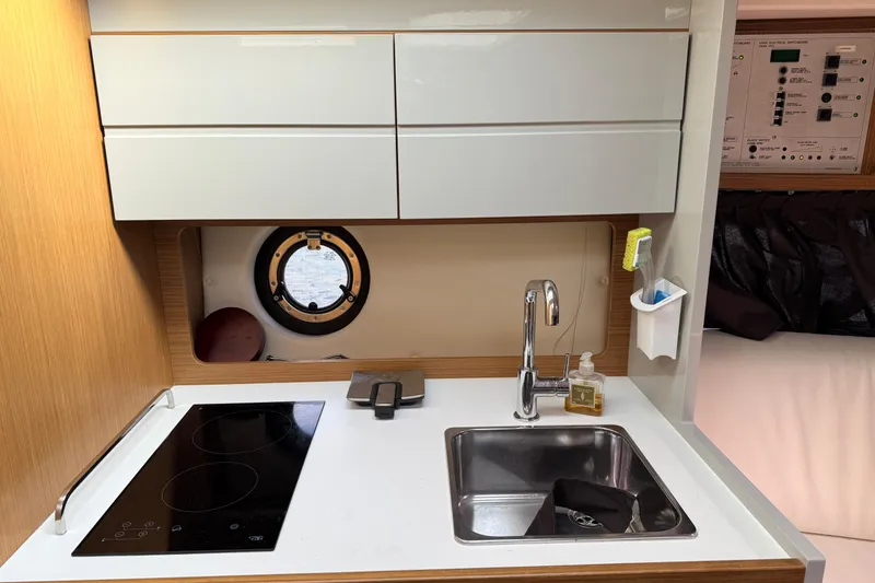 Slide: The Image of Compact kitchen area in a 2014 Azimut Atlantis 34 yacht with sink and stove. - 11