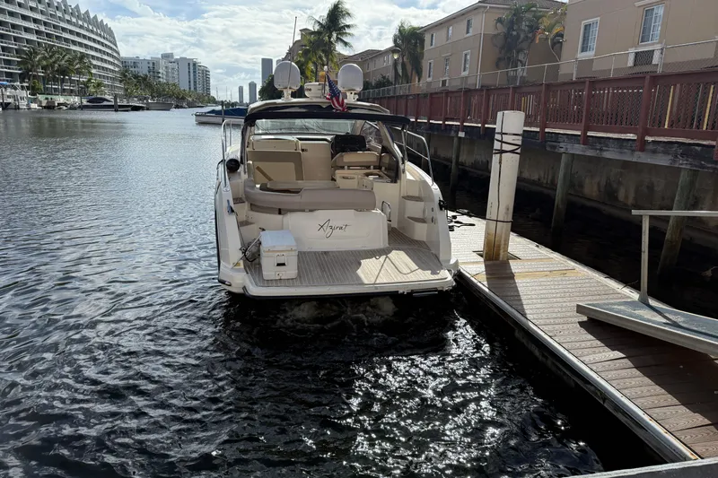 Slide: The Image of 2014 Azimut Atlantis 34 yacht docked in a sunny marina setting. - 4