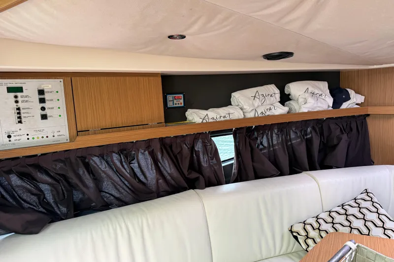 Slide: The Image of Interior of 2014 Azimut Atlantis 34 yacht with control panel and storage area. - 9