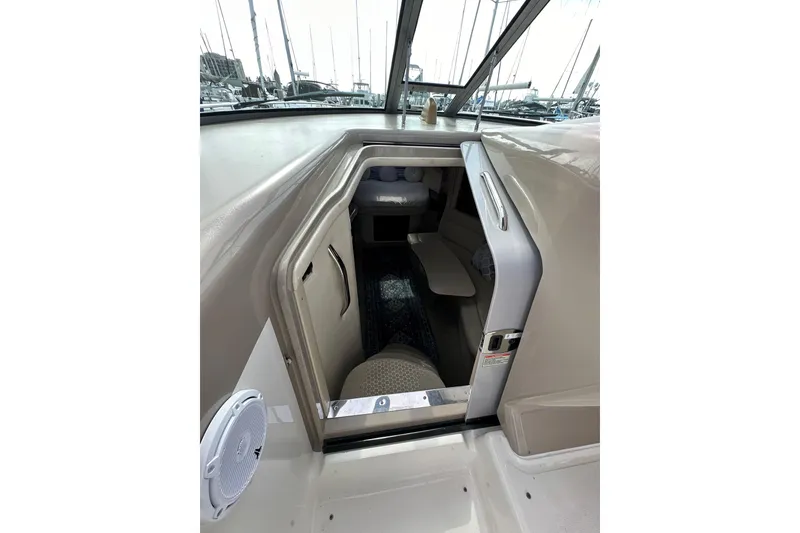 Slide: The Image of 2003 Sea Ray 320 Sundancer cabin entrance with seating and interior view. - 26