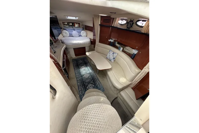 Slide: The Image of Luxurious interior of 2003 Sea Ray 320 Sundancer with cozy seating and elegant decor. - 28