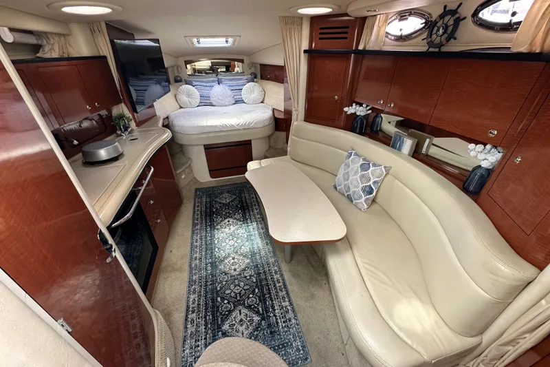 Slide: The Image of Luxurious interior of 2003 Sea Ray 320 Sundancer yacht with elegant seating and decor. - 29