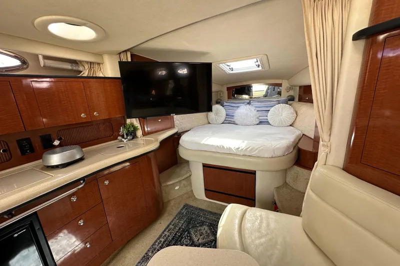 Slide: The Image of Luxurious interior of 2003 Sea Ray 320 Sundancer yacht with cozy bed and modern amenities. - 37
