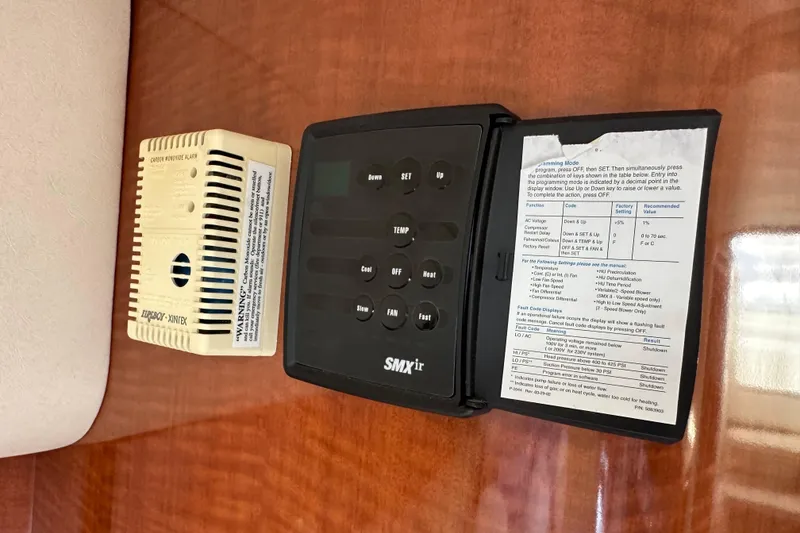 Slide: The Image of Control panel and carbon monoxide alarm on 2003 Sea Ray 320 Sundancer yacht interior. - 41