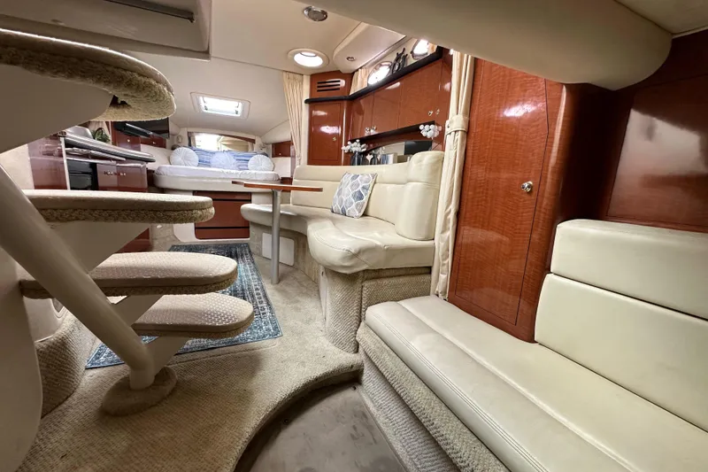 Slide: The Image of Luxurious interior of 2003 Sea Ray 320 Sundancer yacht with plush seating and elegant wood finishes. - 47
