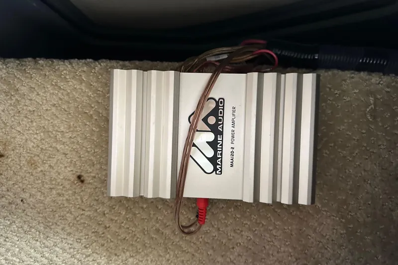Slide: The Image of Marine audio power amplifier on carpeted floor of 2003 Sea Ray 320 Sundancer. - 51
