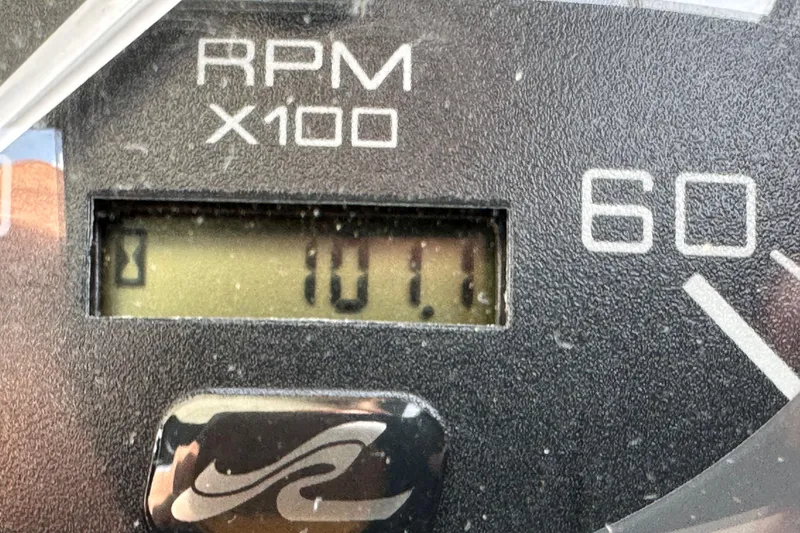 Slide: The Image of Close-up of 2003 Sea Ray 320 Sundancer RPM gauge displaying 101.1. - 55