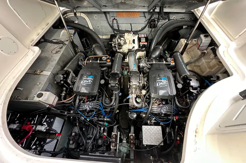 Slide: The Image of Engine compartment of a 2003 Sea Ray 320 Sundancer boat, showcasing dual engines. - 57