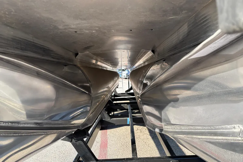 Slide: The Image of Underneath view of 2022 Avalon Catalina 2585 VRB pontoon boat on a trailer. - 32