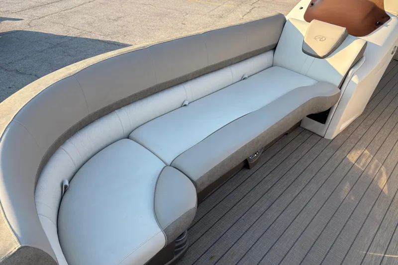 Slide: The Image of 2022 Avalon Catalina 2585 VRB boat interior with sleek, curved seating and modern design. - 34