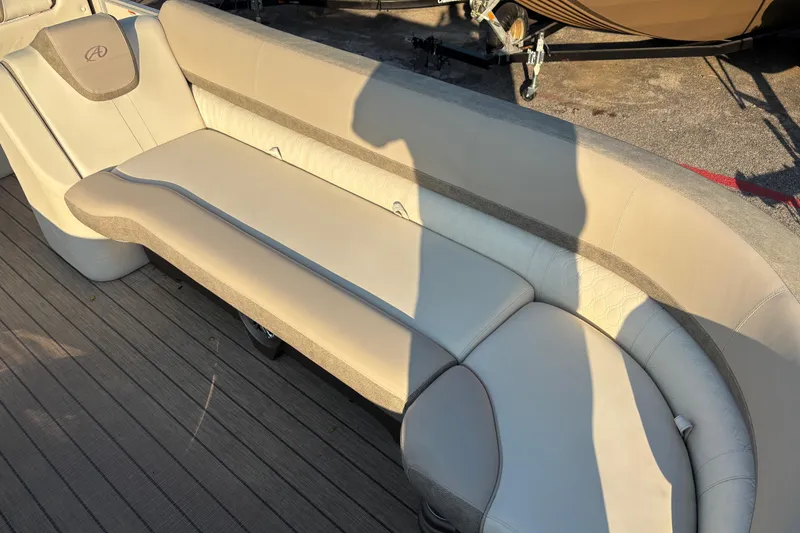 Slide: The Image of 2022 Avalon Catalina 2585 VRB boat interior with beige seating and shadow. - 35