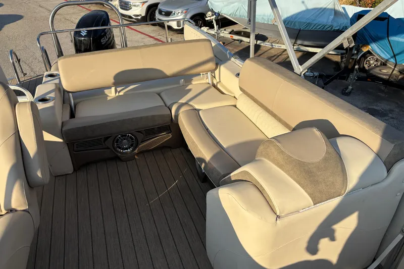 Slide: The Image of 2022 Avalon Catalina 2585 VRB boat interior with beige seating and wood flooring. - 36