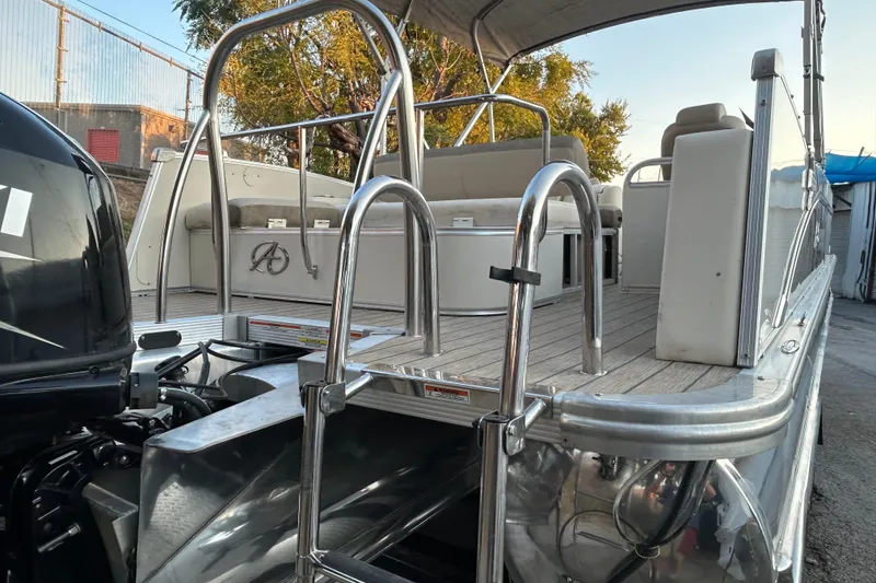 Slide: The Image of 2022 Avalon Catalina 2585 VRB boat side view with logo and canopy. - 4