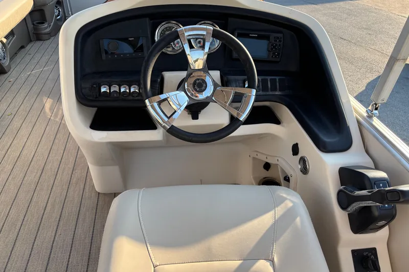 Slide: The Image of 2022 Avalon Catalina 2585 VRB boat helm with steering wheel and control panel. - 40