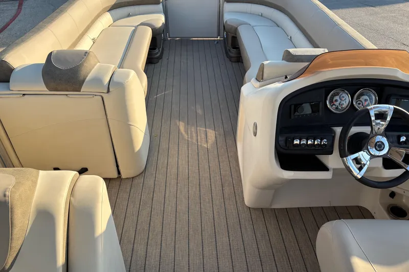 Slide: The Image of Luxurious interior of 2022 Avalon Catalina 2585 VRB pontoon boat with plush seating and modern dashboard. - 42