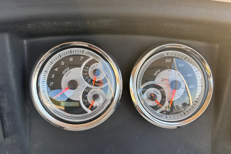 Slide: The Image of Dashboard gauges of a 2022 Avalon Catalina 2585 VRB boat, showing RPM and speed. - 48