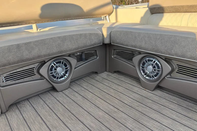 Slide: The Image of 2022 Avalon Catalina 2585 VRB boat interior with speakers and cushioned seating. - 50