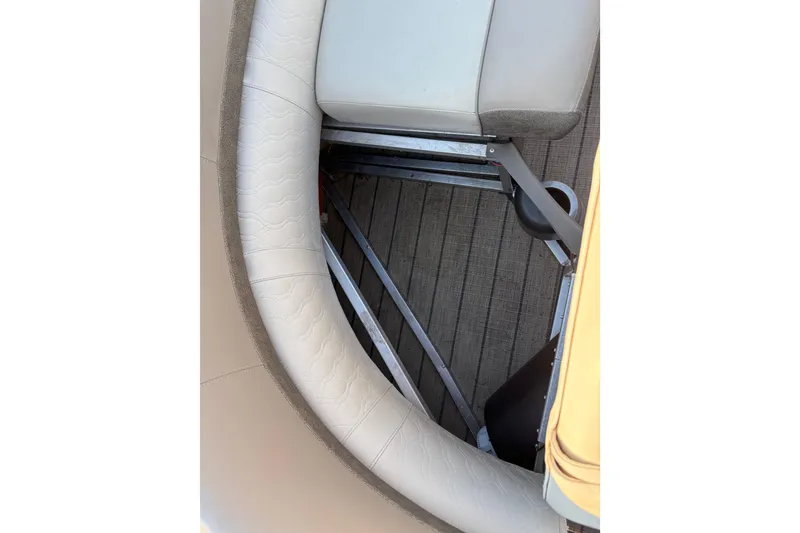 Slide: The Image of Interior seating of 2022 Avalon Catalina 2585 VRB boat, featuring cushioned upholstery and metal framework. - 54
