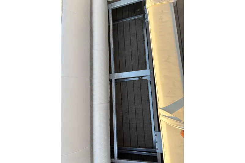 Slide: The Image of 2022 Avalon Catalina 2585 VRB pontoon interior with beige upholstery and metal frame. - 56