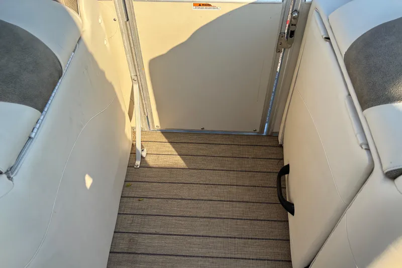 Slide: The Image of Interior view of 2022 Avalon Catalina 2585 VRB boat with beige seating and flooring. - 57